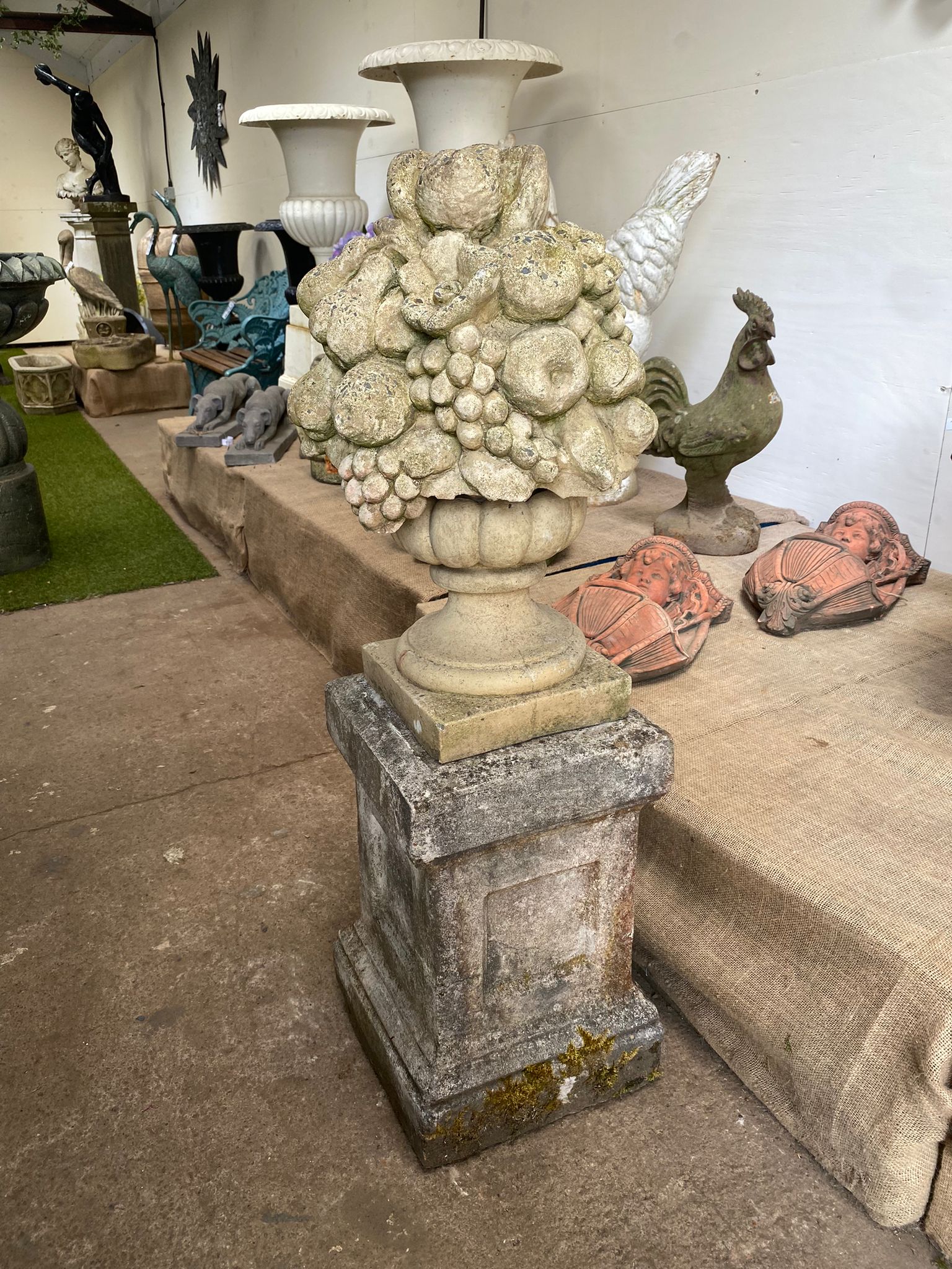 Stone Bowl of Fruit on Stone Plinth