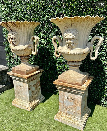 Pair of Cast Iron Urns and Plinths with Snake & Mask Detail