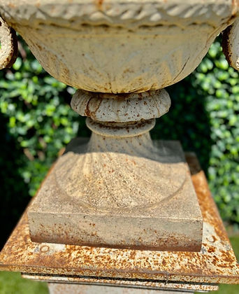 Pair of Cast Iron Urns and Plinths with Snake & Mask Detail