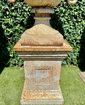 Pair of Cast Iron Urns and Plinths with Snake & Mask Detail