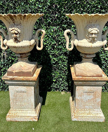 Pair of Cast Iron Urns and Plinths with Snake & Mask Detail